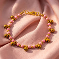 Pink Natural Stone Bracelet for Women, Brass Bell Charm Bracelet, Monk Blessed | Artisan Reverie