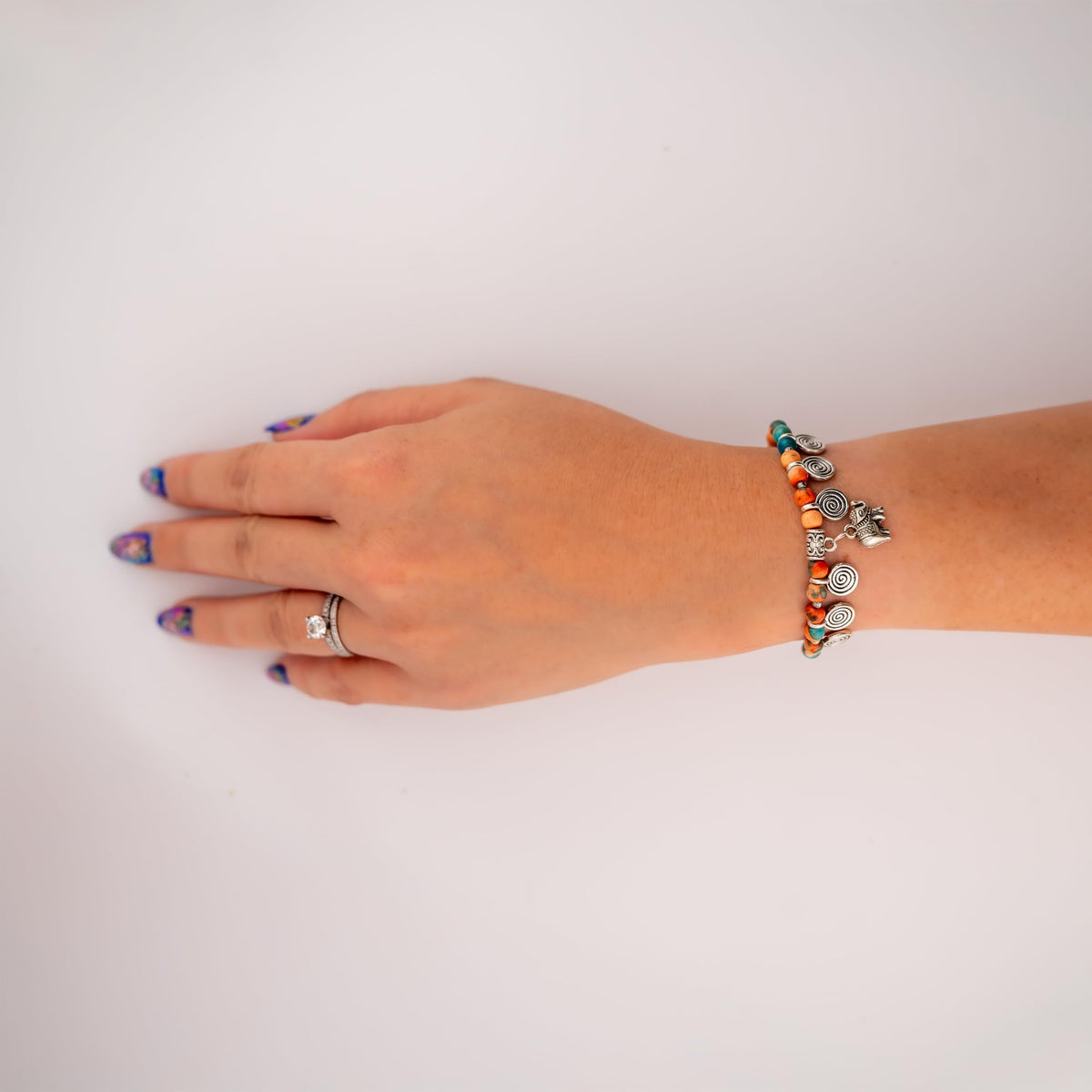 Siam Artisan Collective Boho Bracelet for Women – Turquoise & Orange Stone Beads with Elephant Charm and Spiral Accents – Handcrafted Thai Bohemian Jewelry – Stackable Mixed-Metal Accessory