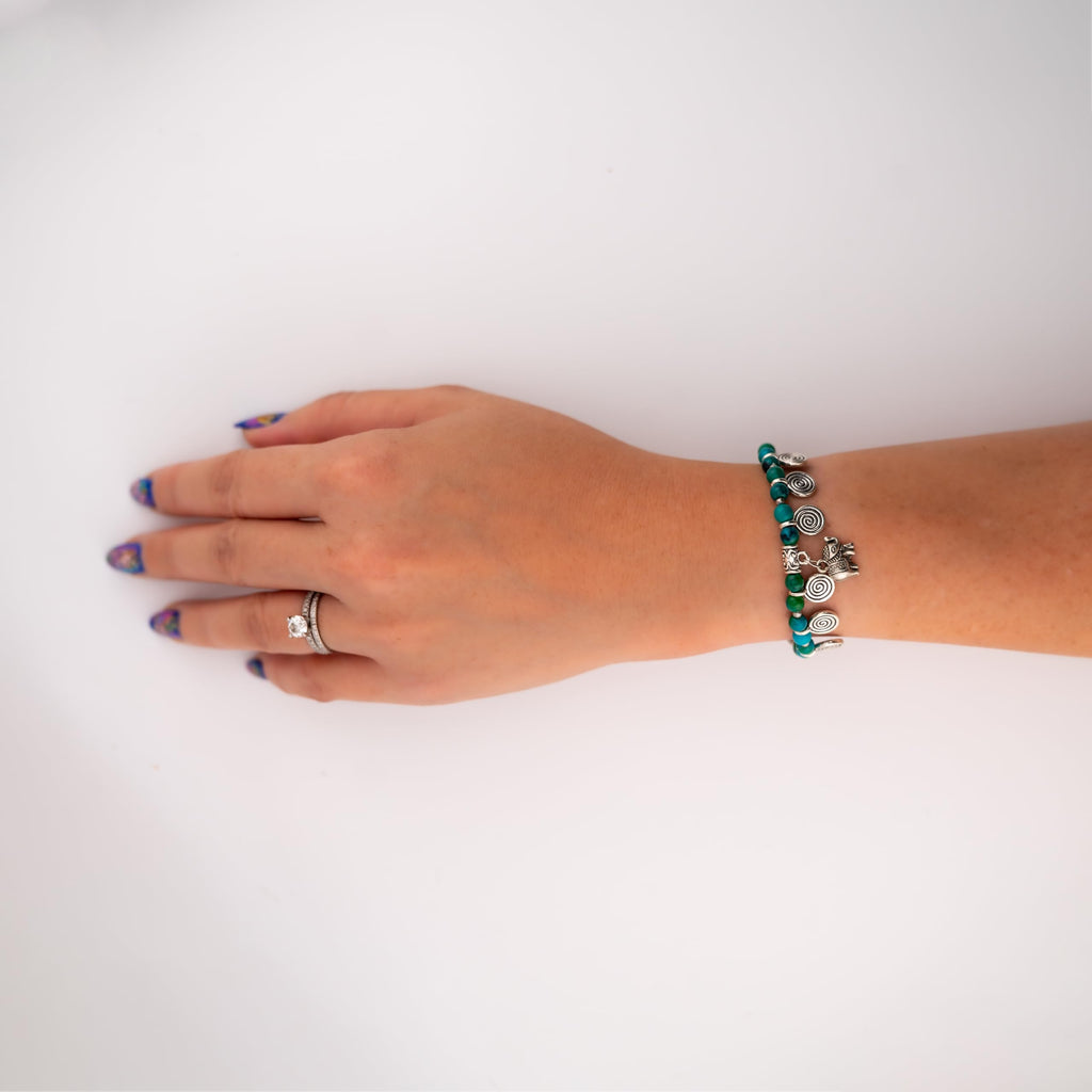 Siam Artisan Collective Boho Charm Bracelet for Women – Blue & Green Beaded Bracelet with Silver Spiral Charms and Elephant Pendant – Handmade Thai Bohemian Jewelry