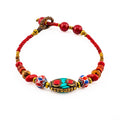 Artisan Nomad™ Tibetan-Style Beaded Bracelet – Handmade Boho Jewelry with Turquoise Inlay & Red Accents